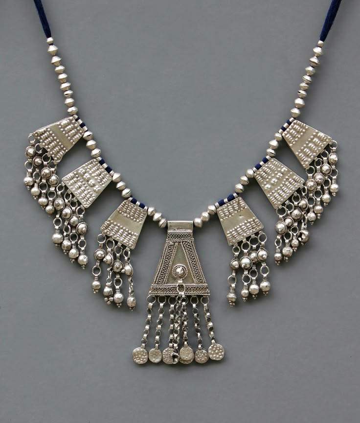 Elaborate silver bib-style necklace